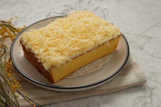 Kue bolu keju Indonesian sponge cheesecake original and pandan flavours, available in Sydney